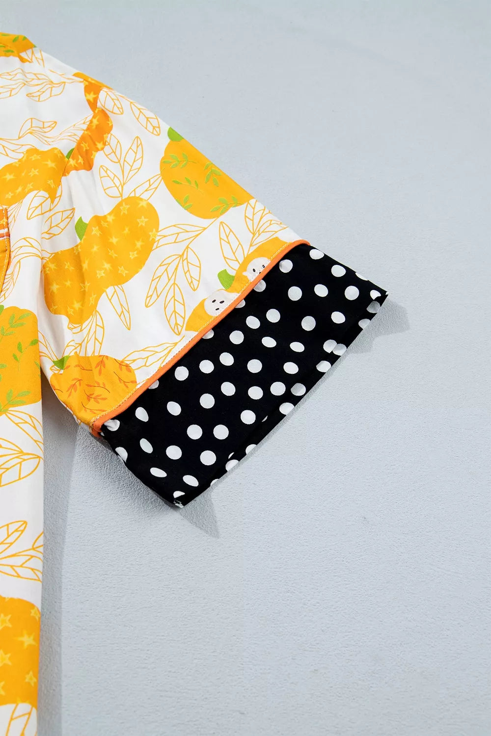 Printed lounge shorts with pumpkin motif and black polka-dot trim