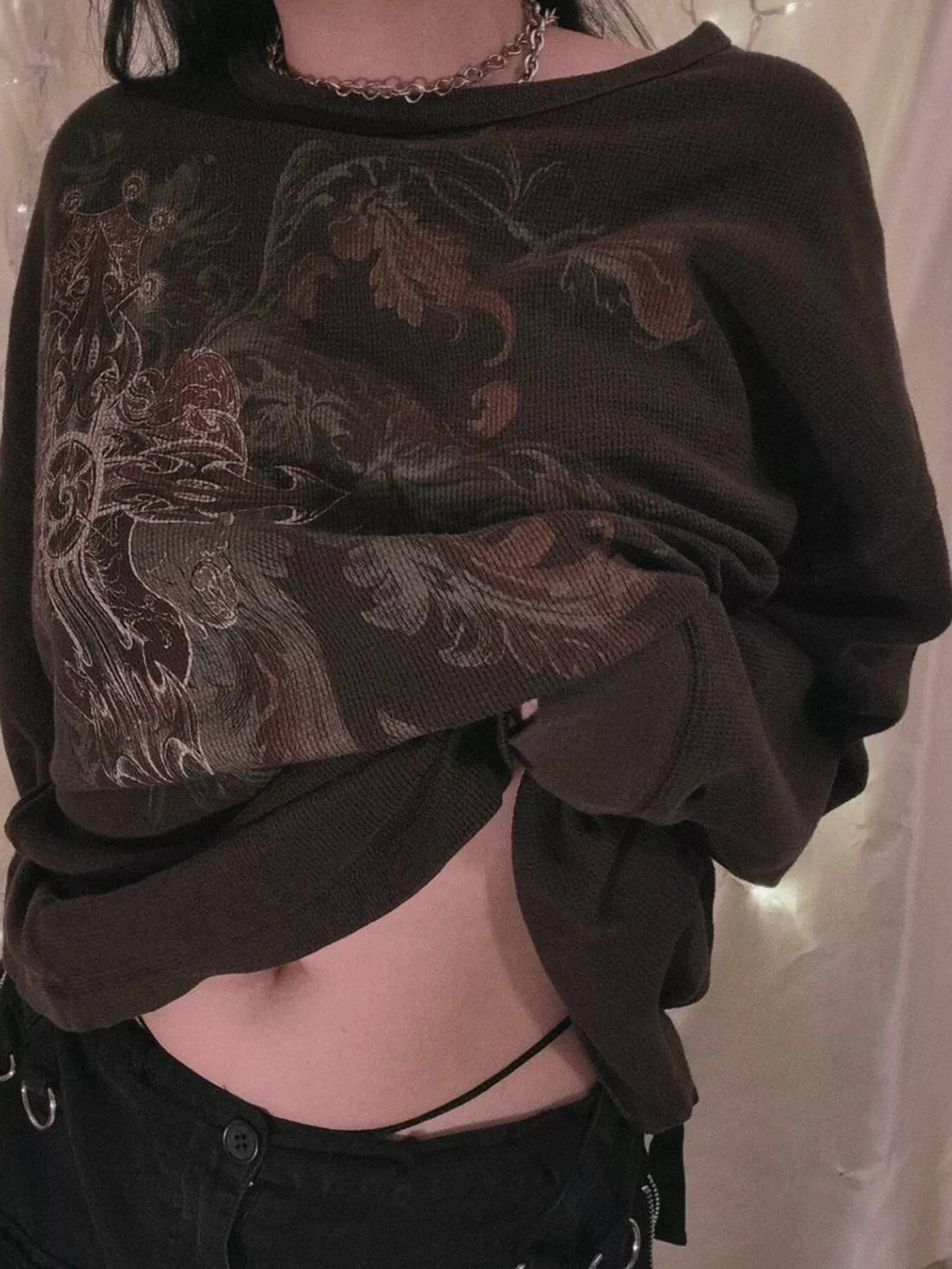 Black long sleeve t-shirt with ornate skull and floral graphic on front