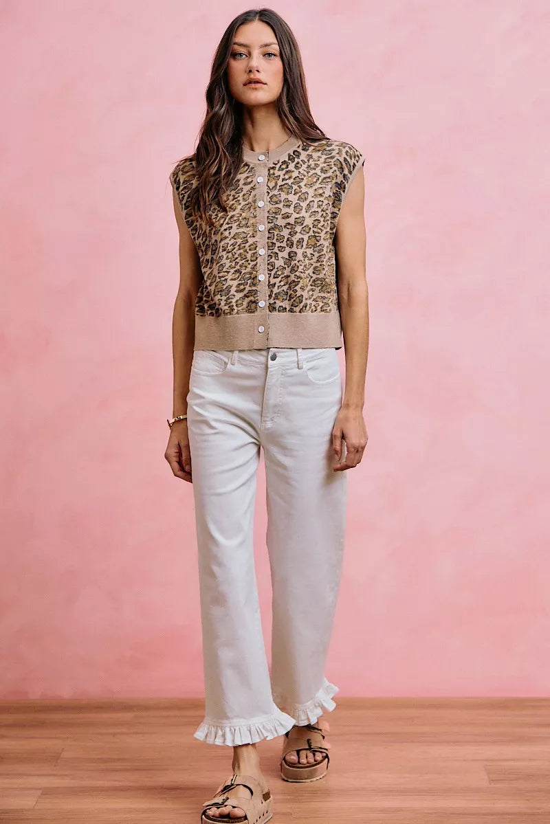 White mid-rise wide-leg jeans with ruffled hem and button front