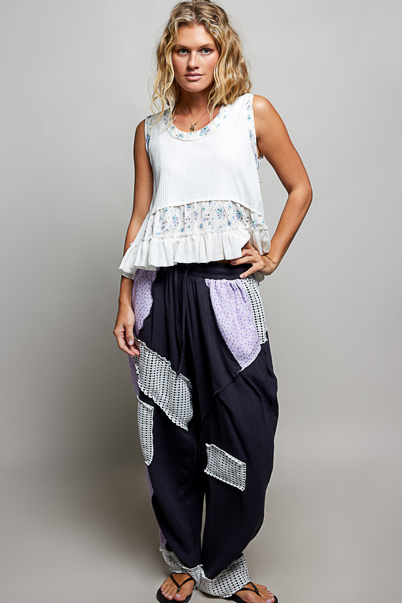 Off-white ribbed tank top with floral band and double ruffle hem