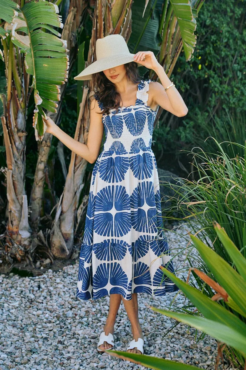 Smocked bodice tiered midi dress with navy and white abstract print, sleeveless