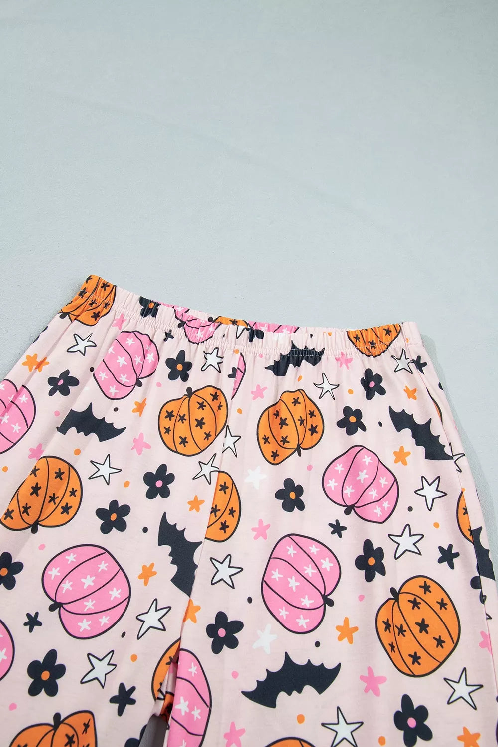 Pink pumpkin print pajama shorts with elastic waistband, front view