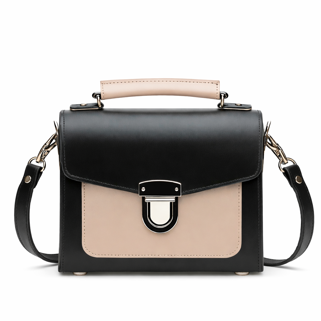 Black leather crossbody handbag with beige flap, silver buckle, and top handle