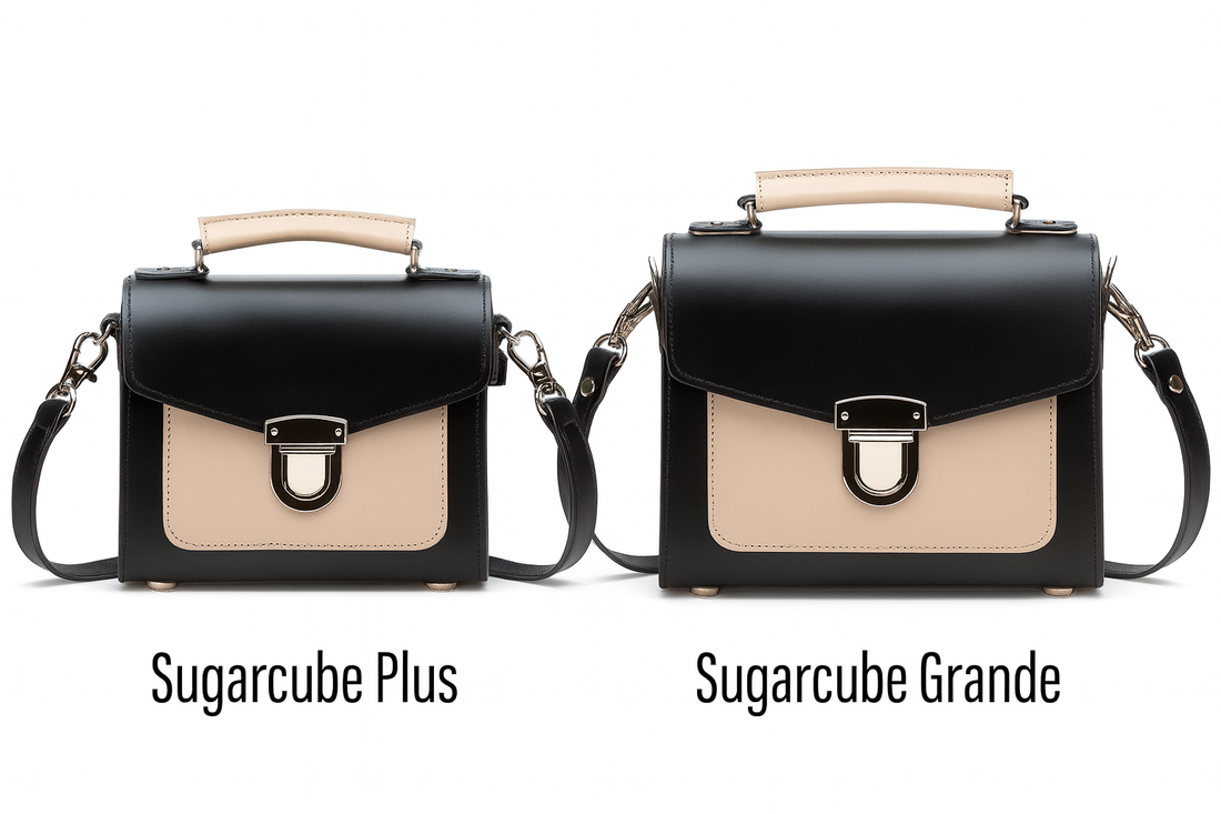 Pair of black leather crossbody handbags with beige flap and silver buckle, side-by-side