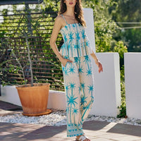 Blue palm-print sleeveless cami top with smocked bodice and adjustable straps