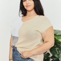Beige color-block knit V-neck top with short sleeves; gray panel along side