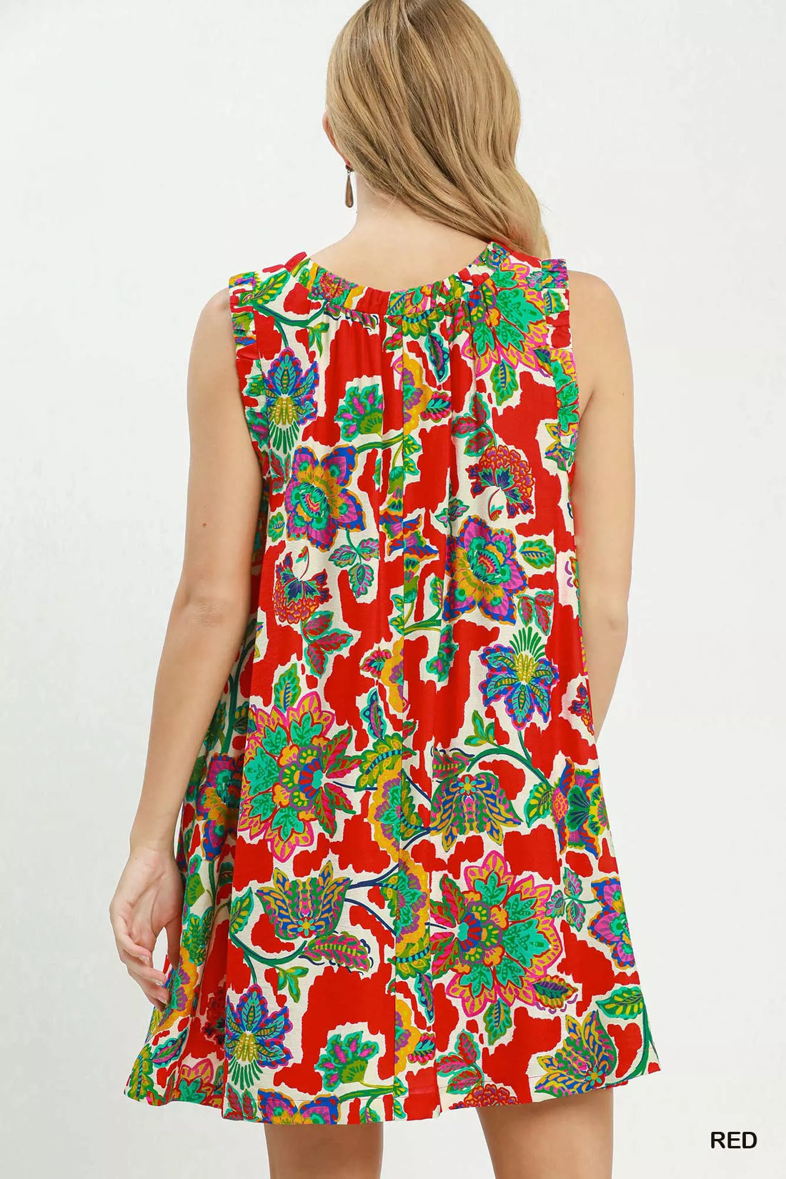 Back view of red sleeveless shift dress with colorful abstract floral print