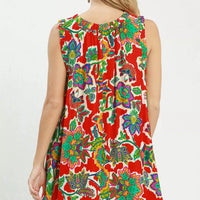 Back view of red sleeveless shift dress with colorful abstract floral print