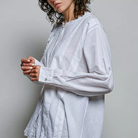 Ivory lightweight woven shirt with ruffle trim round neck, long sleeves, button placket