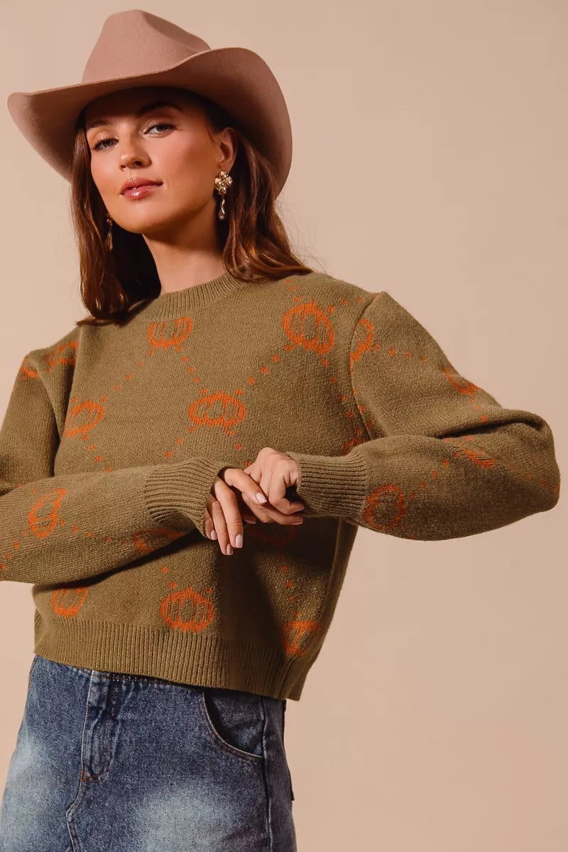 Olive crewneck sweater with orange pumpkin rhombus pattern, ribbed cuffs and hem