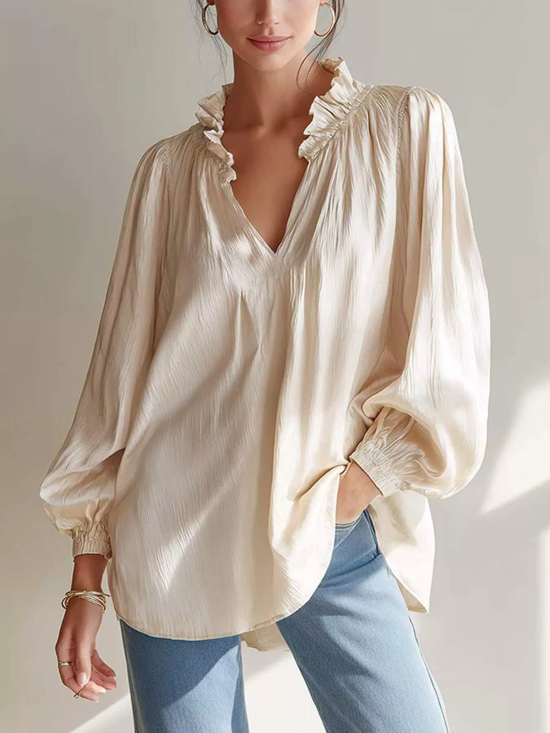Beige ruffle-trim long-sleeve blouse with V-neck and frilled neckline