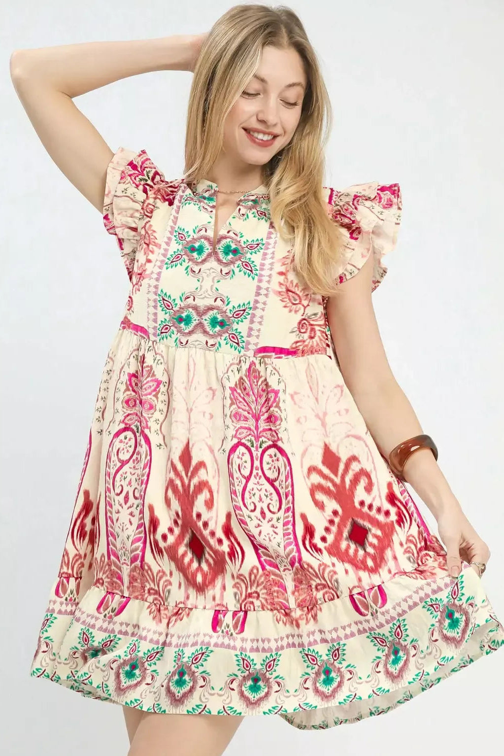 Boho print ruffle sleeve dress in pink and red paisley with teal accents and tiered skirt