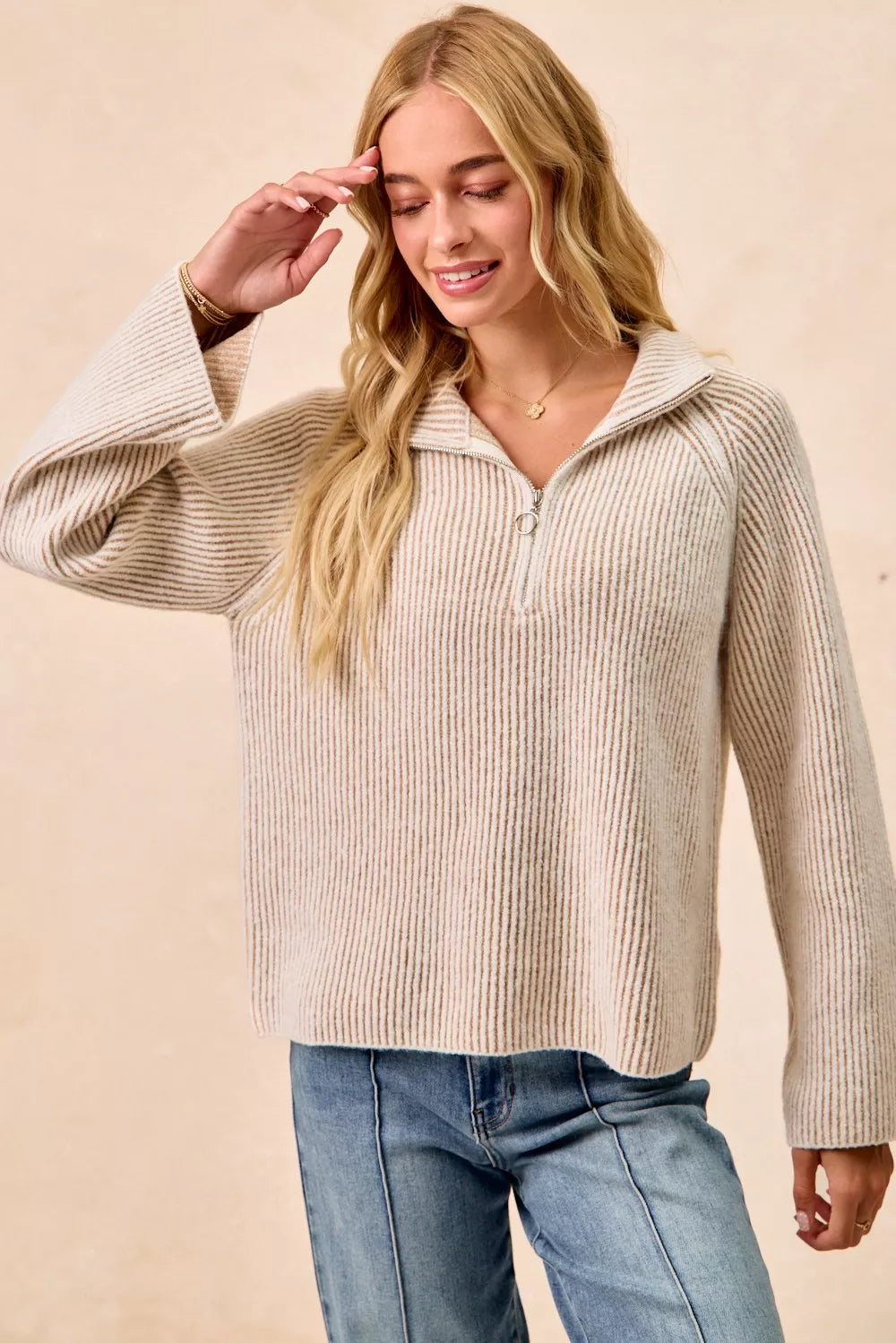 Two-tone rib knit zip-collar top, taupe and cream, standing side view