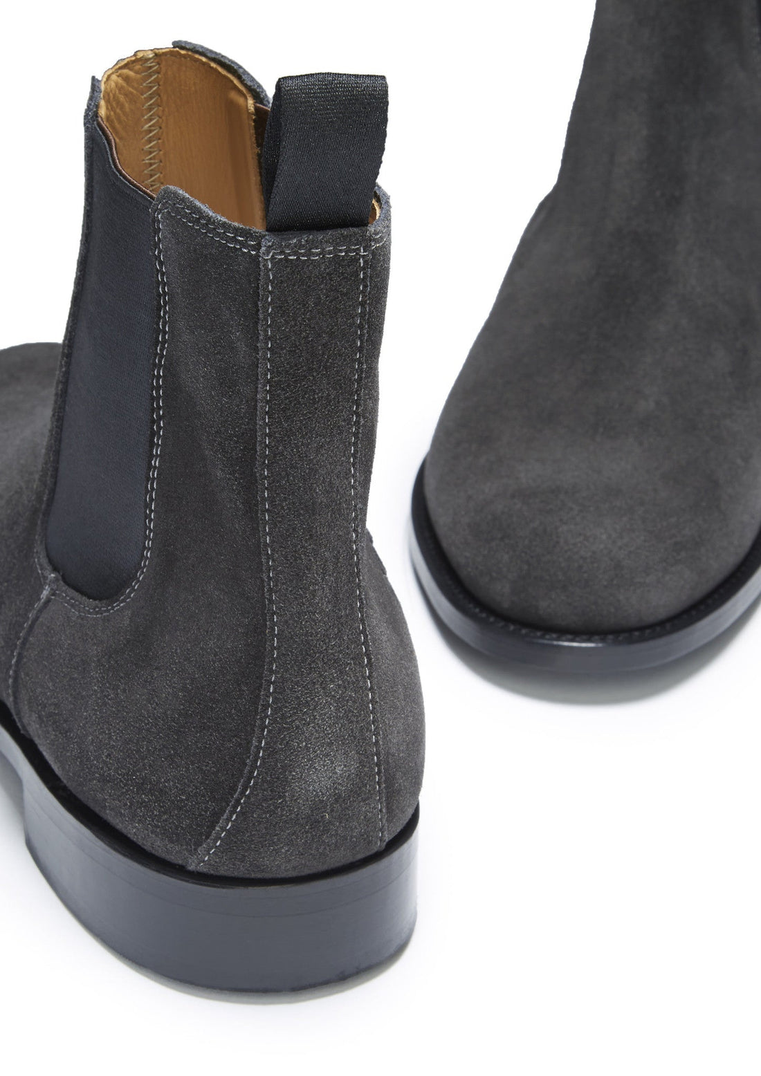 Close-up of a gray suede Chelsea boot&