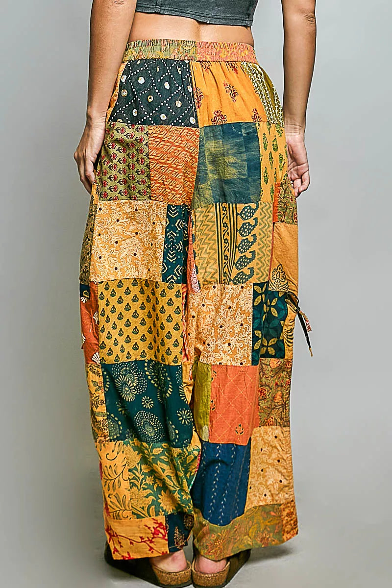 Patchwork wide-leg printed pants with elastic waistband and side drawstring ties