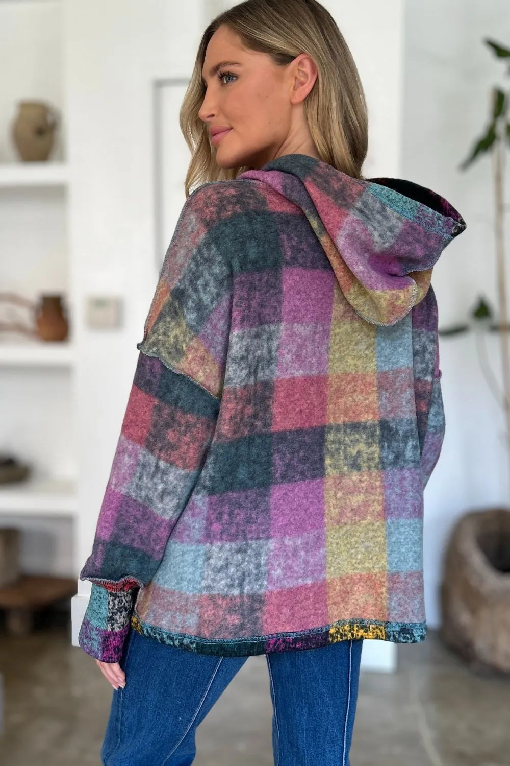 Multicolor plaid fleece hoodie shown from back with hood and dropped shoulder seams