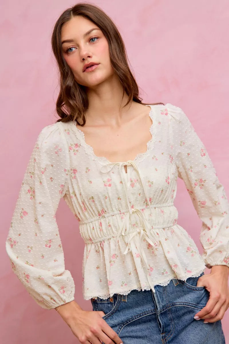 White floral clip-dot blouse with scalloped lace neckline, ruched bodice, and puff sleeves