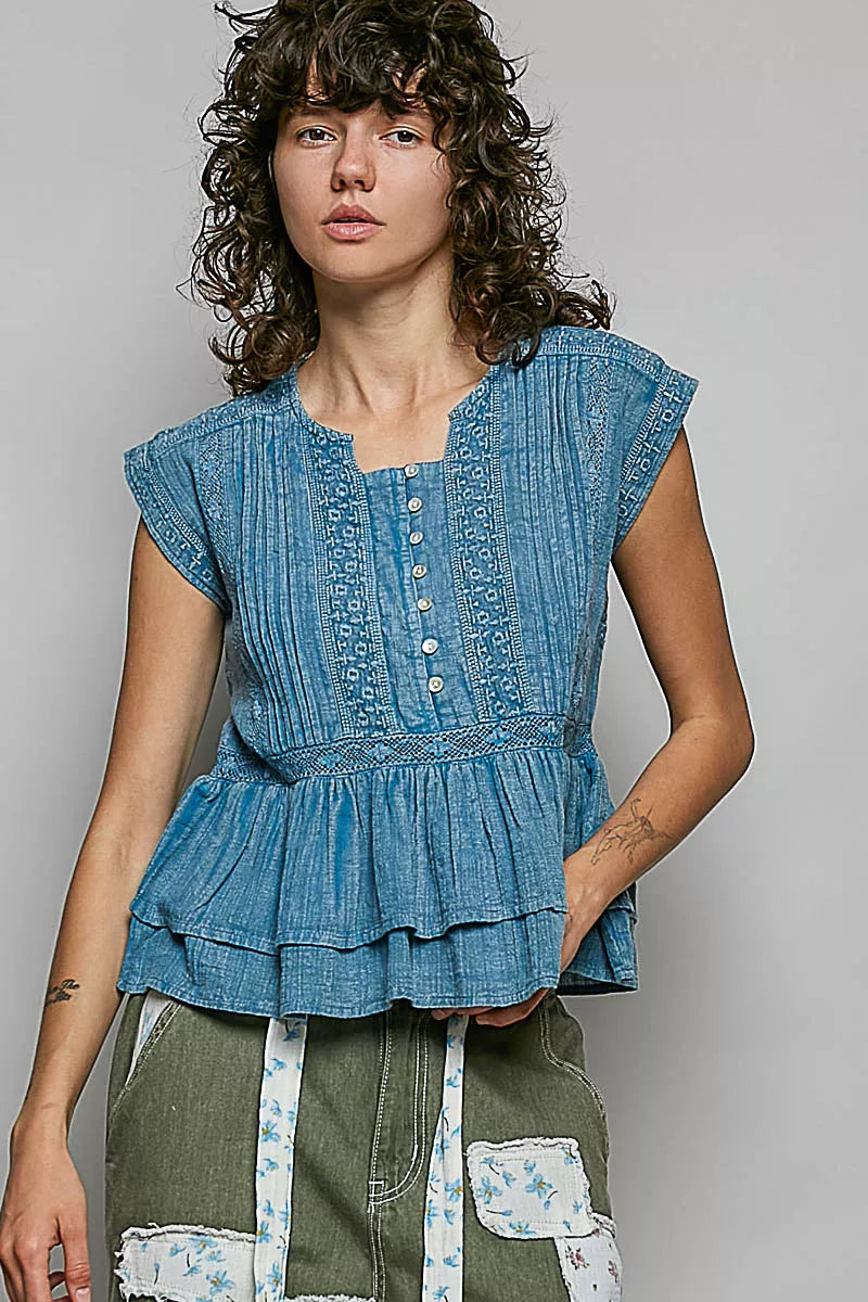 Denim blue sleeveless embroidered pintuck peplum blouse with button placket