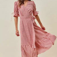 Red striped wrap midi dress with short puff sleeves and flowing tiered skirt