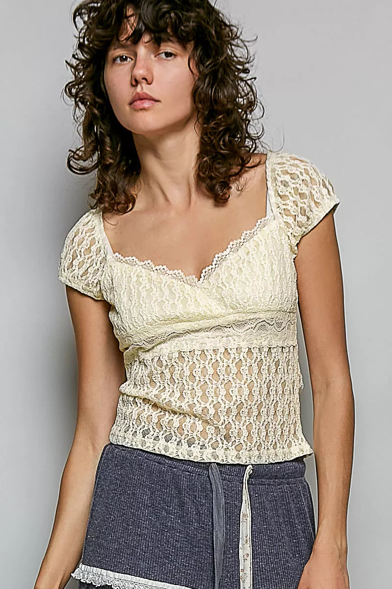 Natural lace short-sleeve top with sweetheart neckline and gathered texture