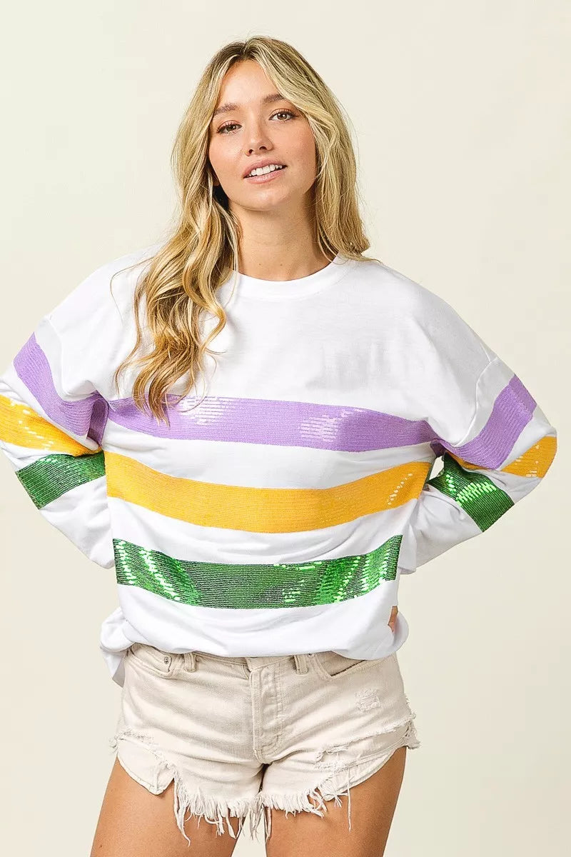 Off-white round-neck sweatshirt with sequined purple, yellow, and green chest stripe
