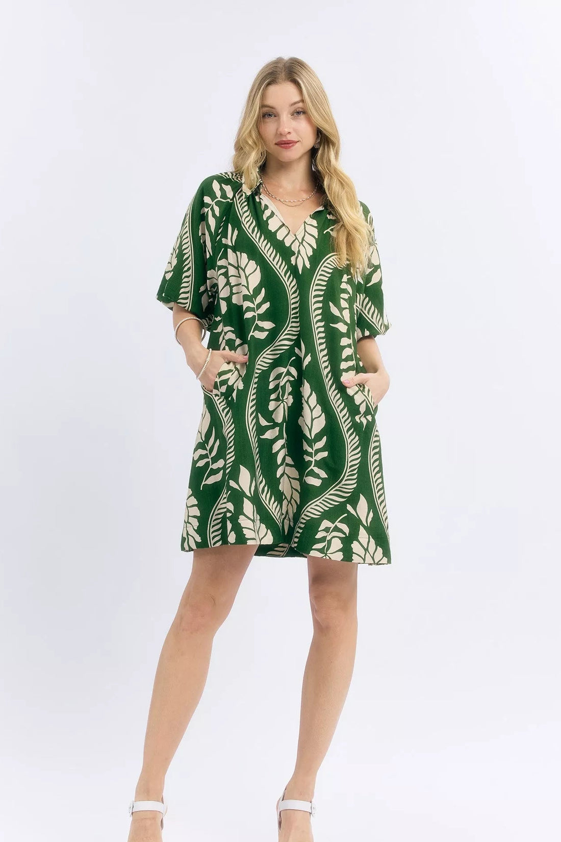 Green and cream leafy print mini dress with V-neck and short sleeves