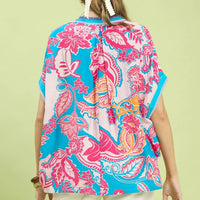 Back of oversized blue print top with pink floral paisley and short sleeves