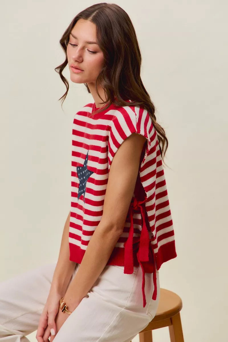Red and ivory striped sleeveless vest top with navy star patch and side tie tassels