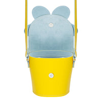 Pastel yellow leather barrel bag with light blue interior lining and ear-shaped top