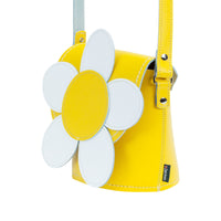 Handmade pastel yellow leather barrel bag with daisy appliqué and shoulder strap