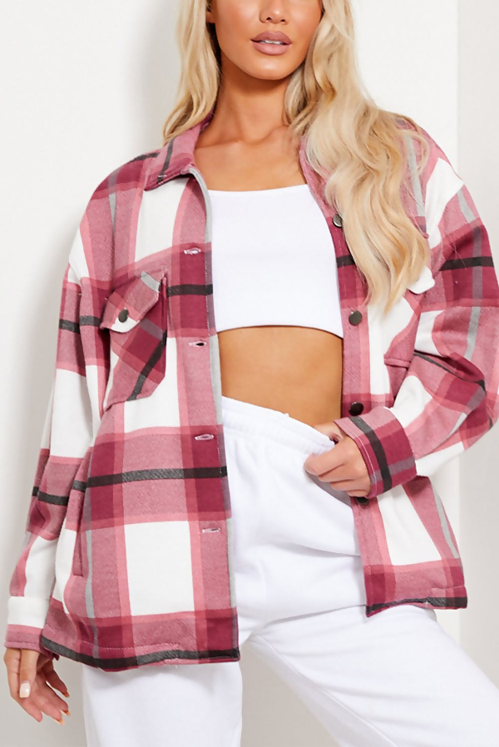 Pink plaid women’s shacket with chest pockets, button front, and long sleeves