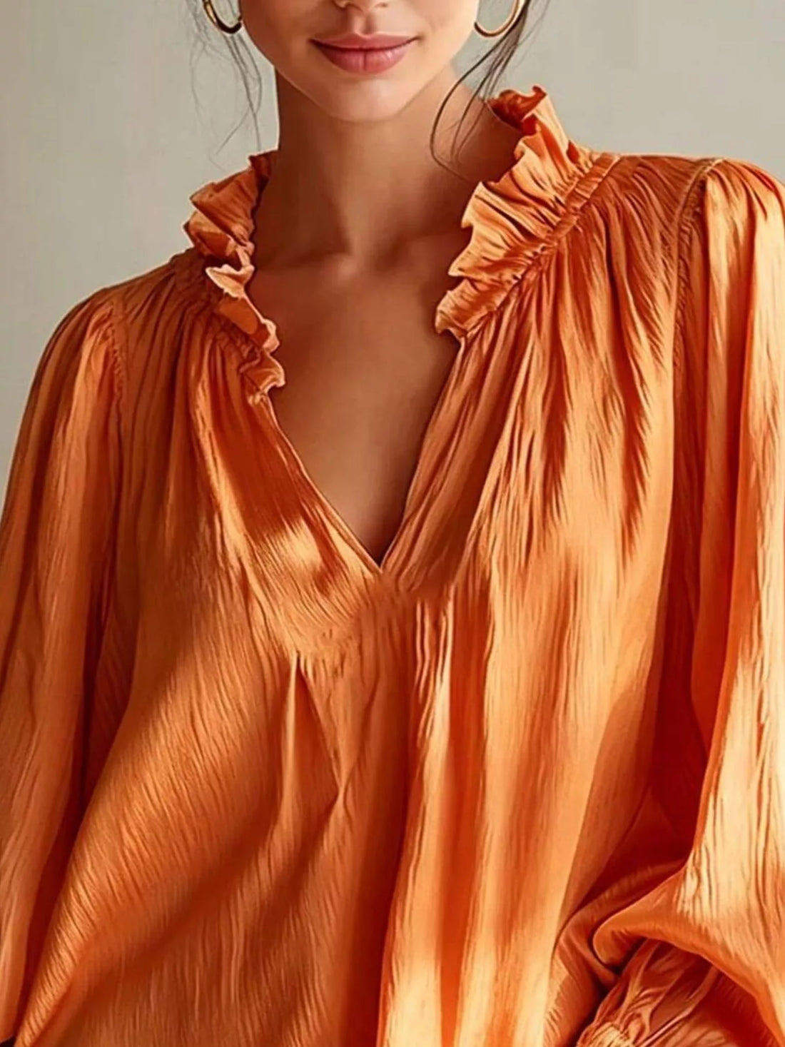Tangerine ruffle-trim long-sleeve blouse with V-neck and frilled neckline