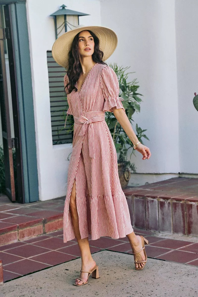 Red-and-white striped wrap midi dress with V-neck and tied waist, short puff sleeves