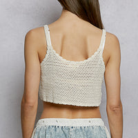 Back view of ivory crochet cropped cami with wide straps and floral stitching