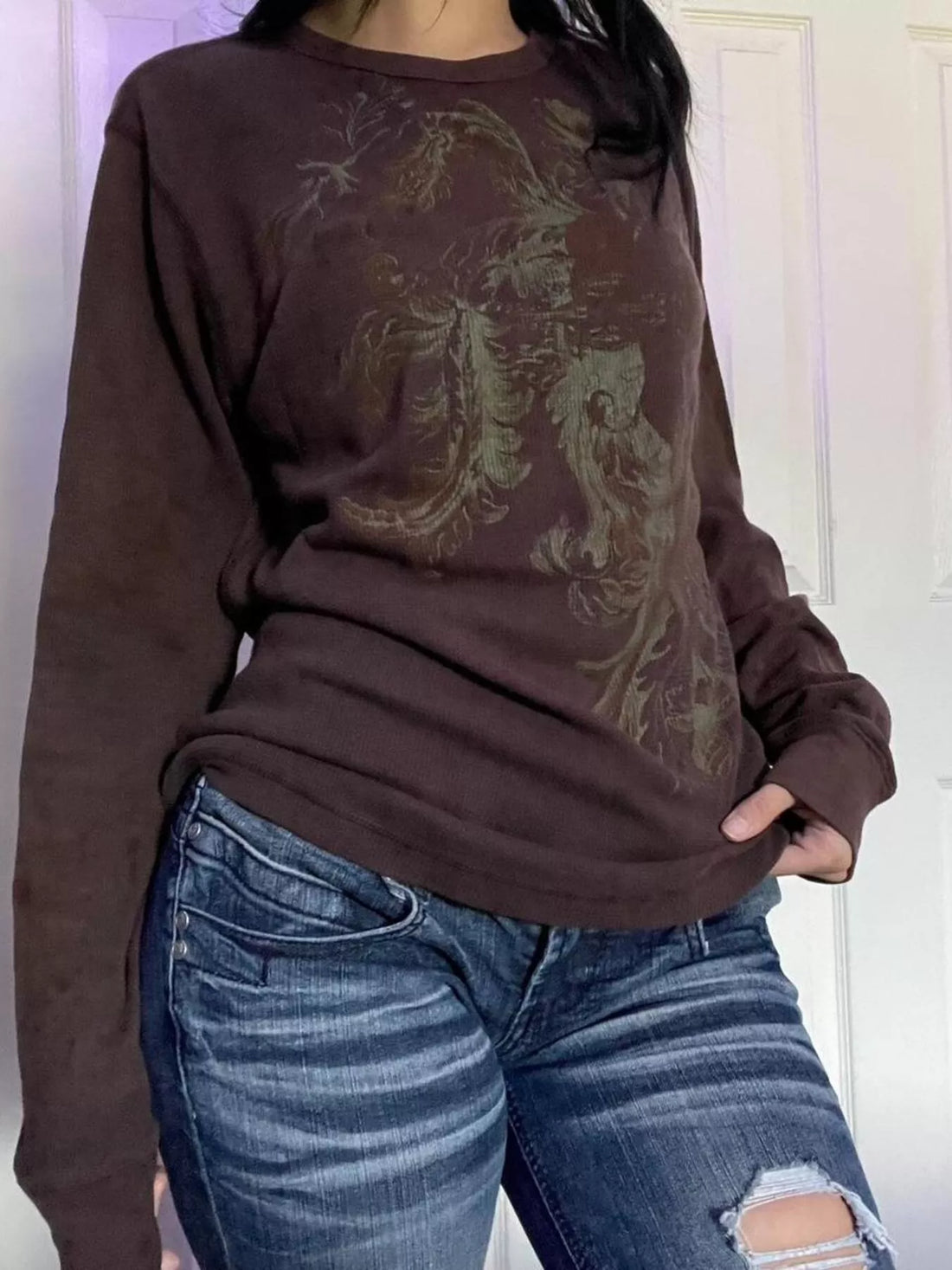 Dark brown long sleeve t-shirt with ornate floral skull graphic on front
