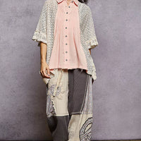 Women’s baby pink button-front pleated shirt with lace crochet patch and ruffled hem