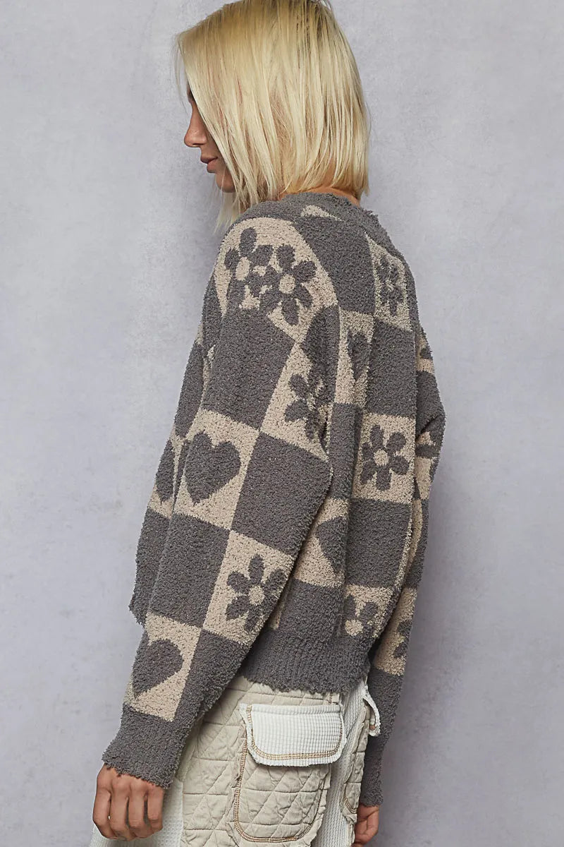 Women’s heart checkered sweater back view, gray with beige heart and flower motifs.