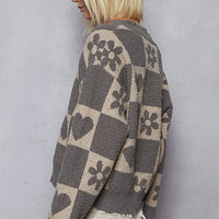 Women’s heart checkered sweater back view, gray with beige heart and flower motifs.