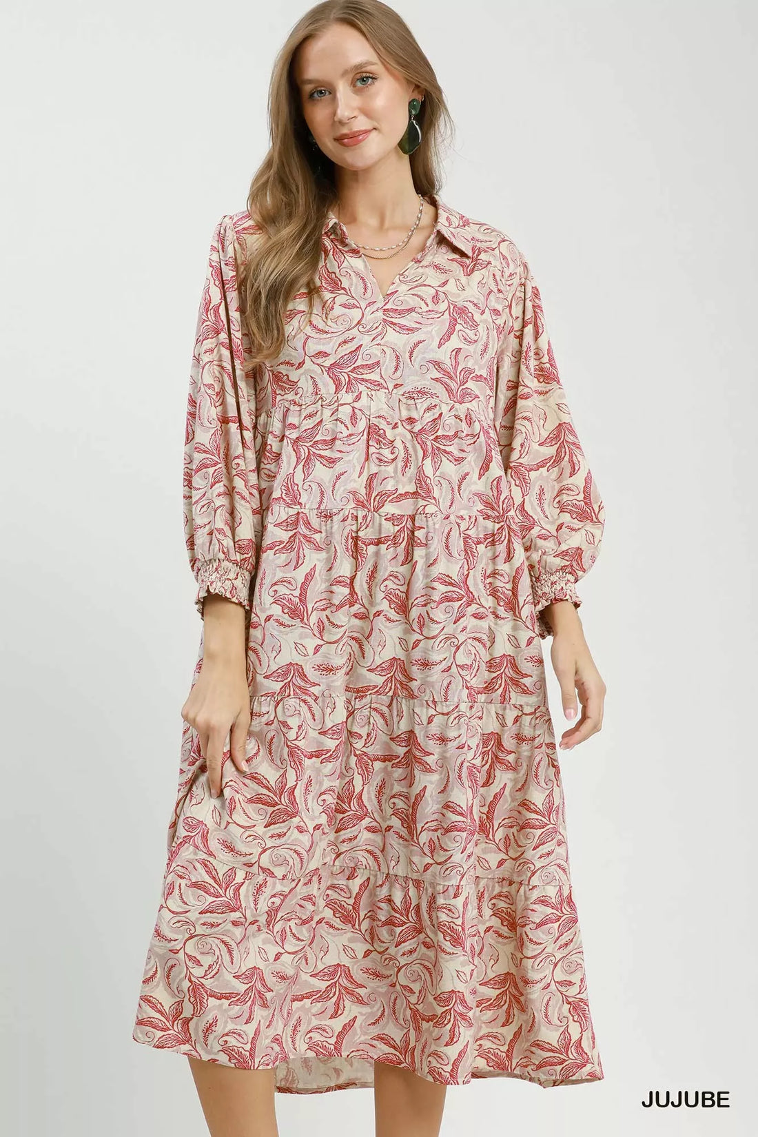 Tiered midi dress with pink botanical print, long sleeves, and tiered skirt