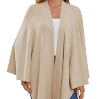 Ivory shawl cape with open front, draped hem, and long cape sleeves