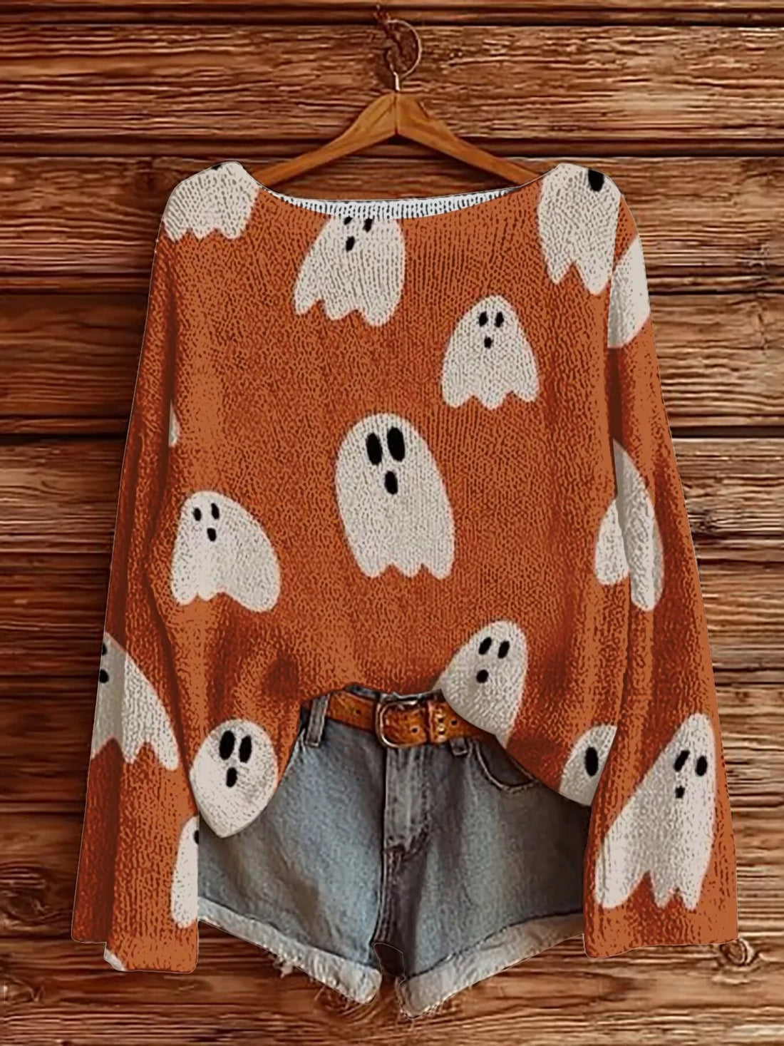 Plus-size Halloween boat-neck sweater in orange with ghost faces and pumpkin graphics