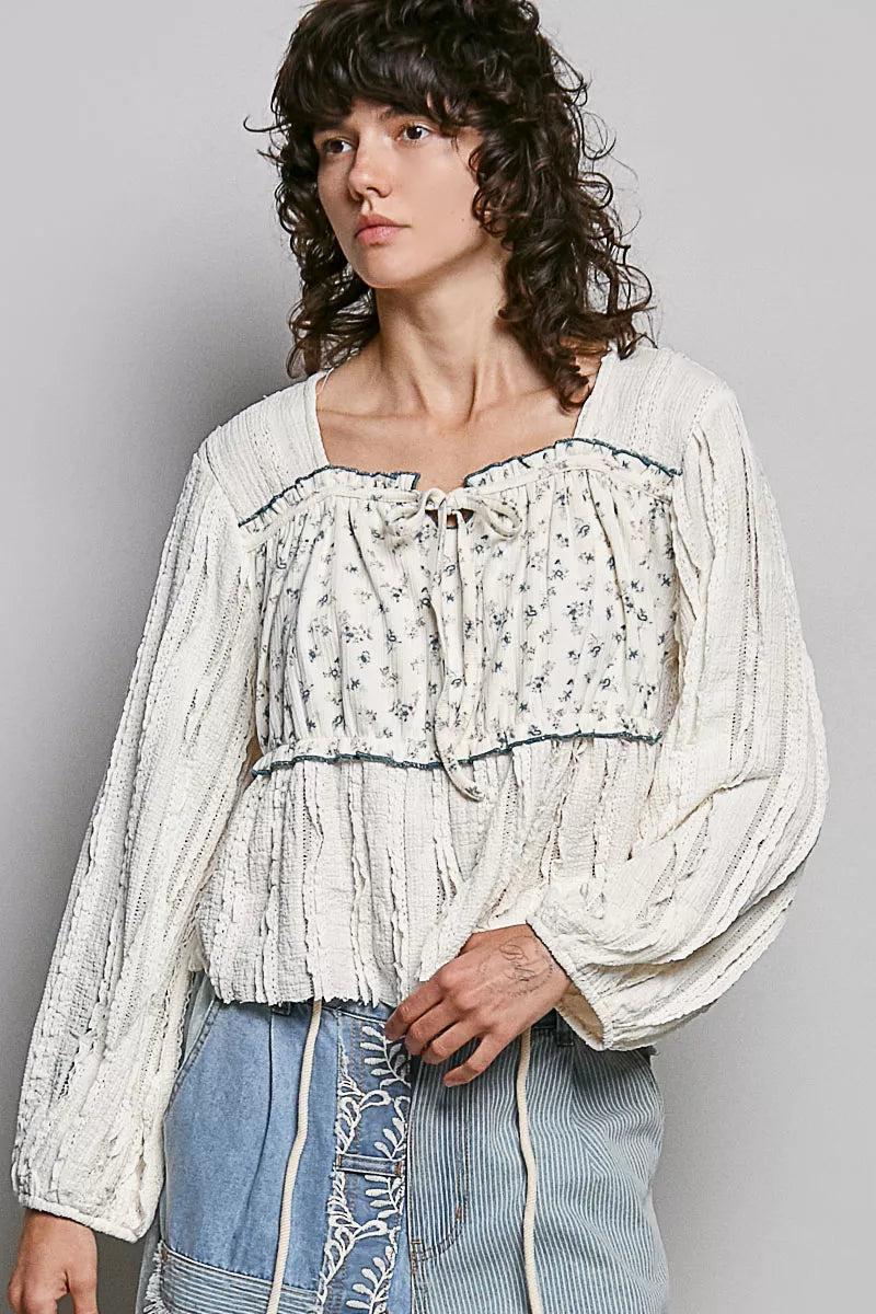Cream lace square-neck long balloon sleeve top with gathered ruffle neckline, blue trim