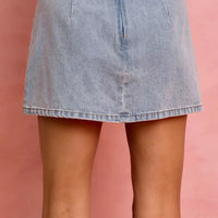 Light blue denim mini skirt with a simple front and frayed hem edge.