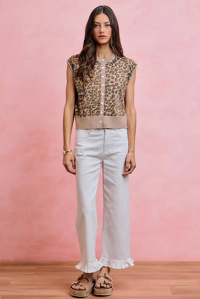 White mid-rise wide-leg jeans with ruffled hem and front pockets