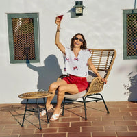 Off-white dolman sweater top with red-white-blue ribbon bow trim and V-neck