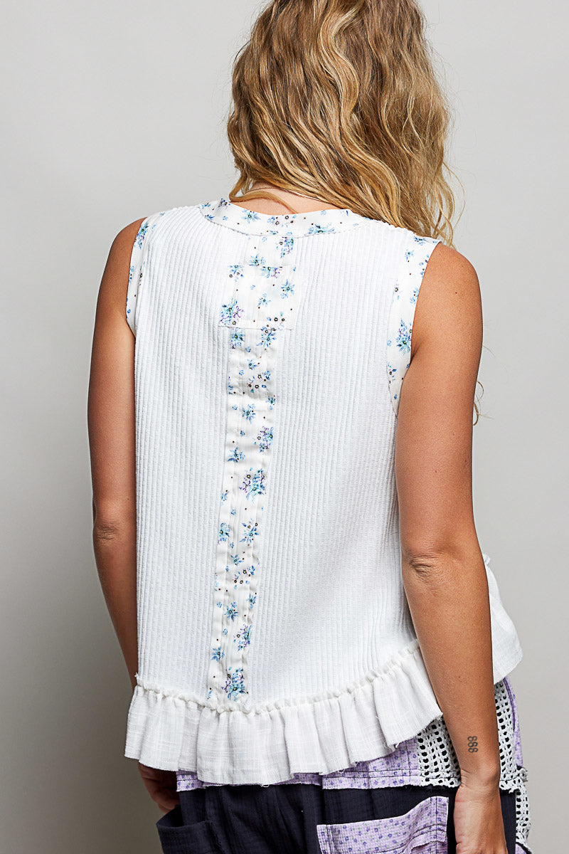 Off-white ribbed back tank with vertical floral print and ruffle hem