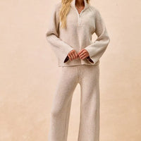 Taupe ribbed knit top with quarter-zip stand collar and long sleeves