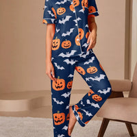 Navy short-sleeve button pajama set with orange pumpkins and bats, matching lounge pants