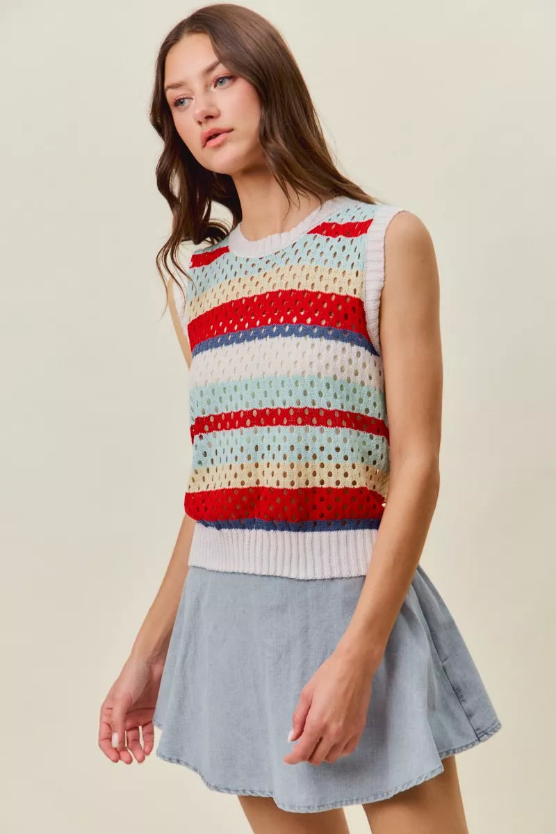 Women’s sweater knit tank top paired with a light blue skirt, striped knit
