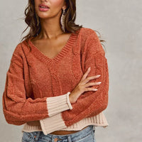 Rust chenille V-neck sweater with cream ribbed cuffs and contrast hem band
